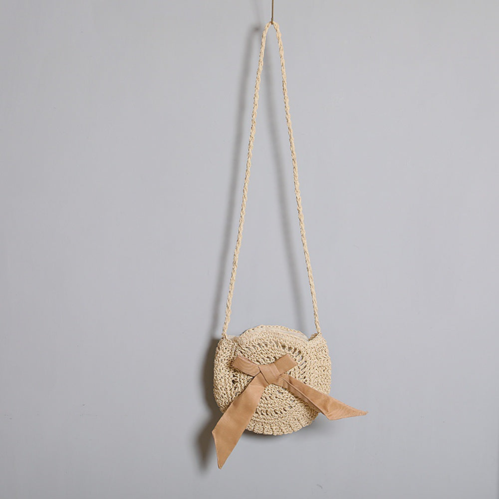 Handwoven shoulder bag with decorative bow accent Bowlift