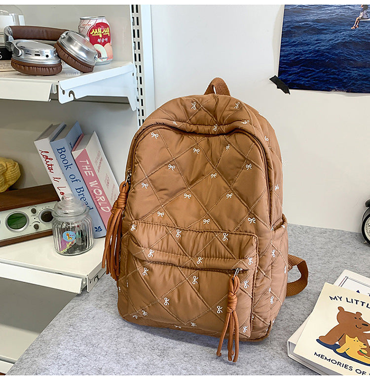 Quilted Backpack with Decorative Tassels