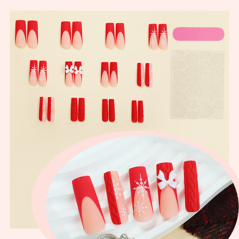Artificial nail set with festive snowflake and bow motifs Bowlift