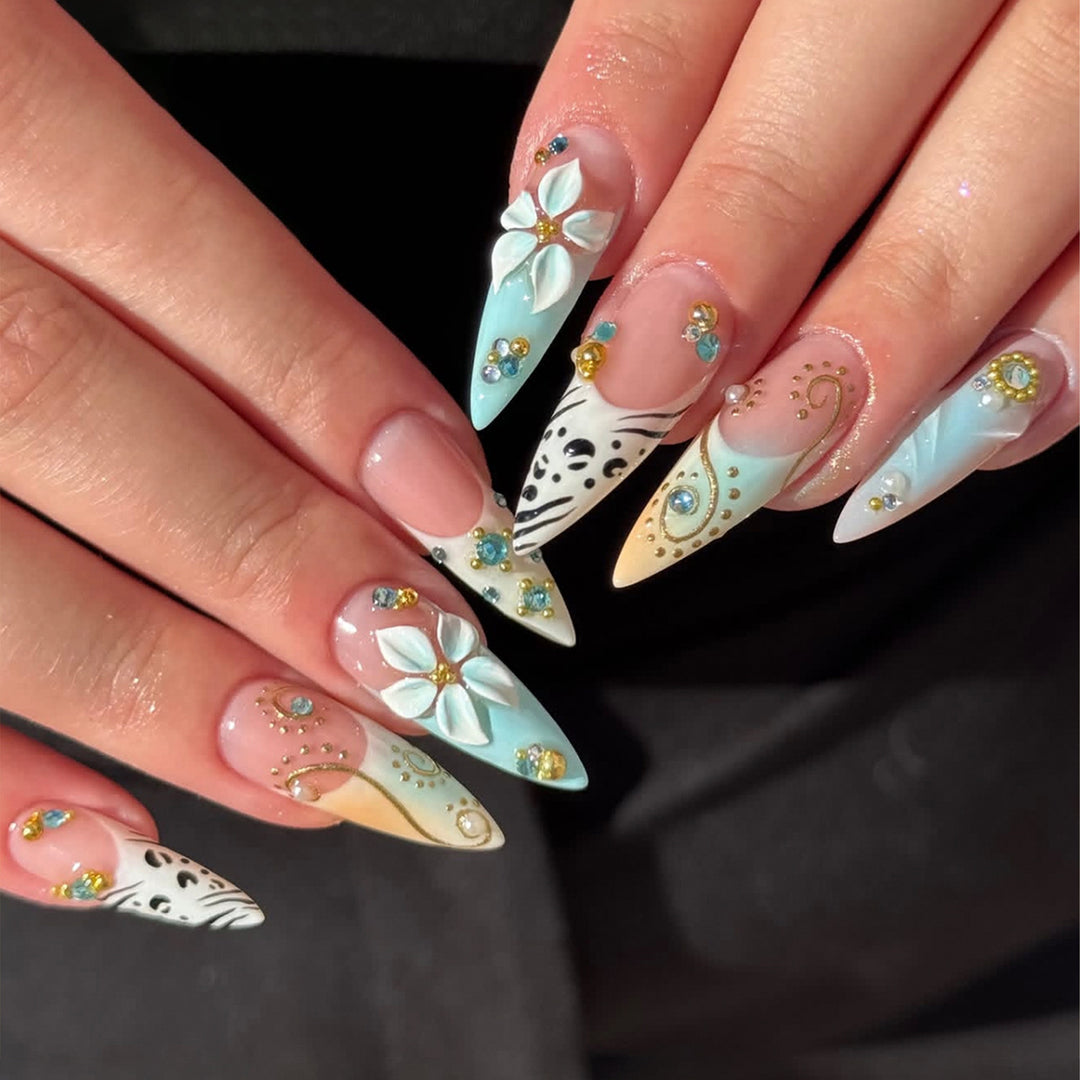 Artistic stiletto nails with floral accents and glitter details Bowlift