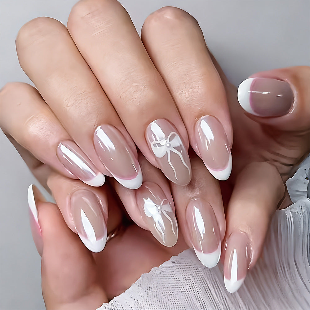 Elegant French Tip Press-On Nails with Bow Accents Bowlift
