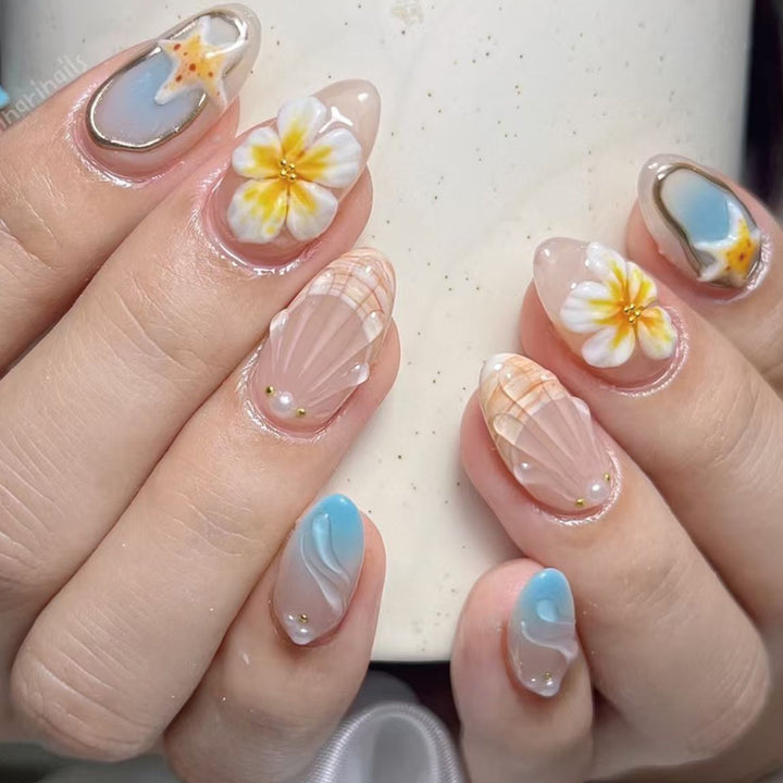 Artistic Nail Design Set with Floral and Seaside Accents Bowlift