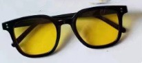 Women striking retro sunglasses with yellow-tinted lenses Bowlift