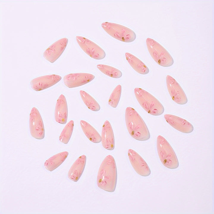 Artificial nail set with floral accents and gold embellishments Bowlift