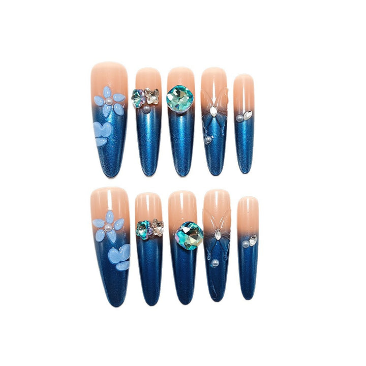 Artificial nails in elegant design with artistic decorations and glitter accents Bowlift