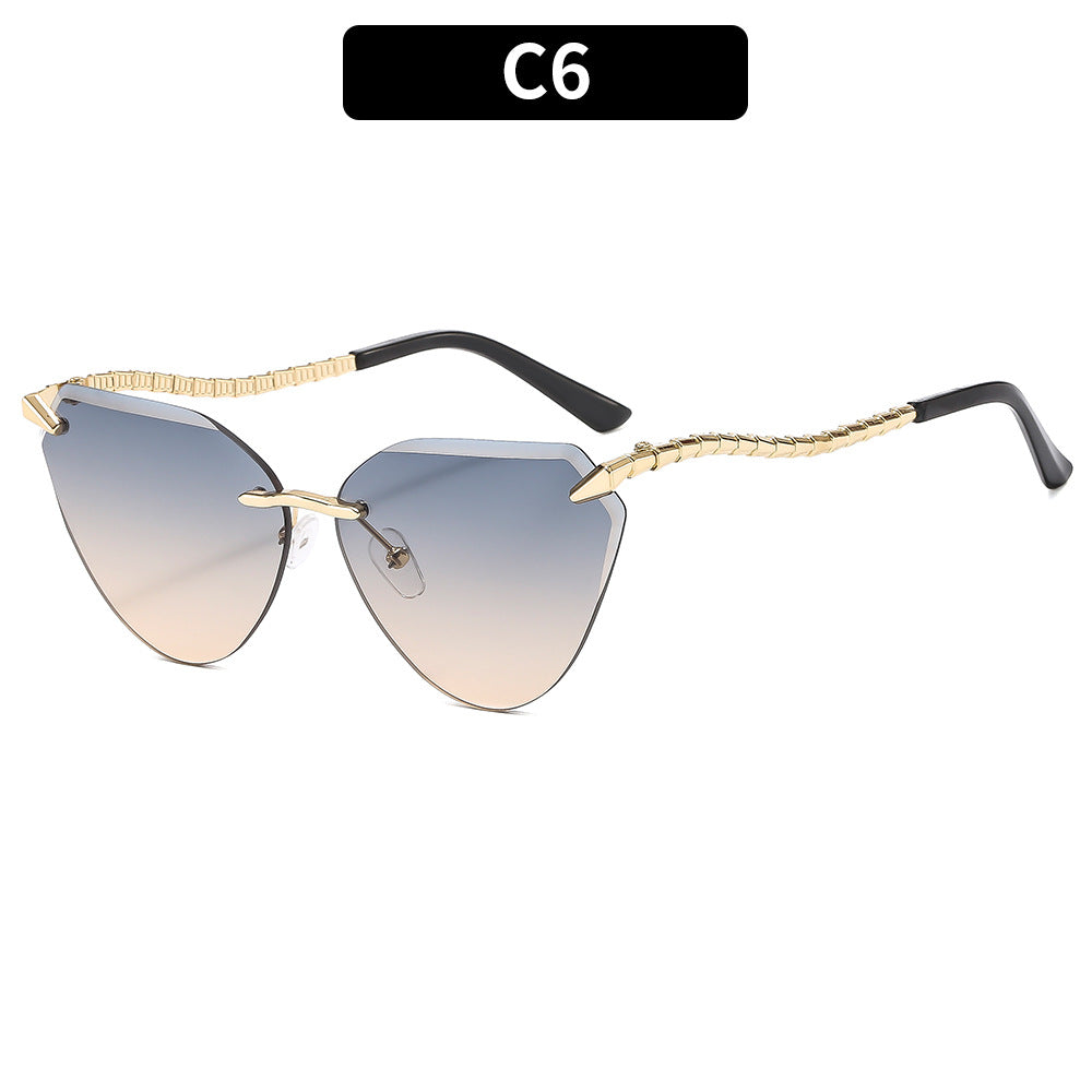 Sculptural Cat-Eye Sunglasses with Decorative Gold Accents