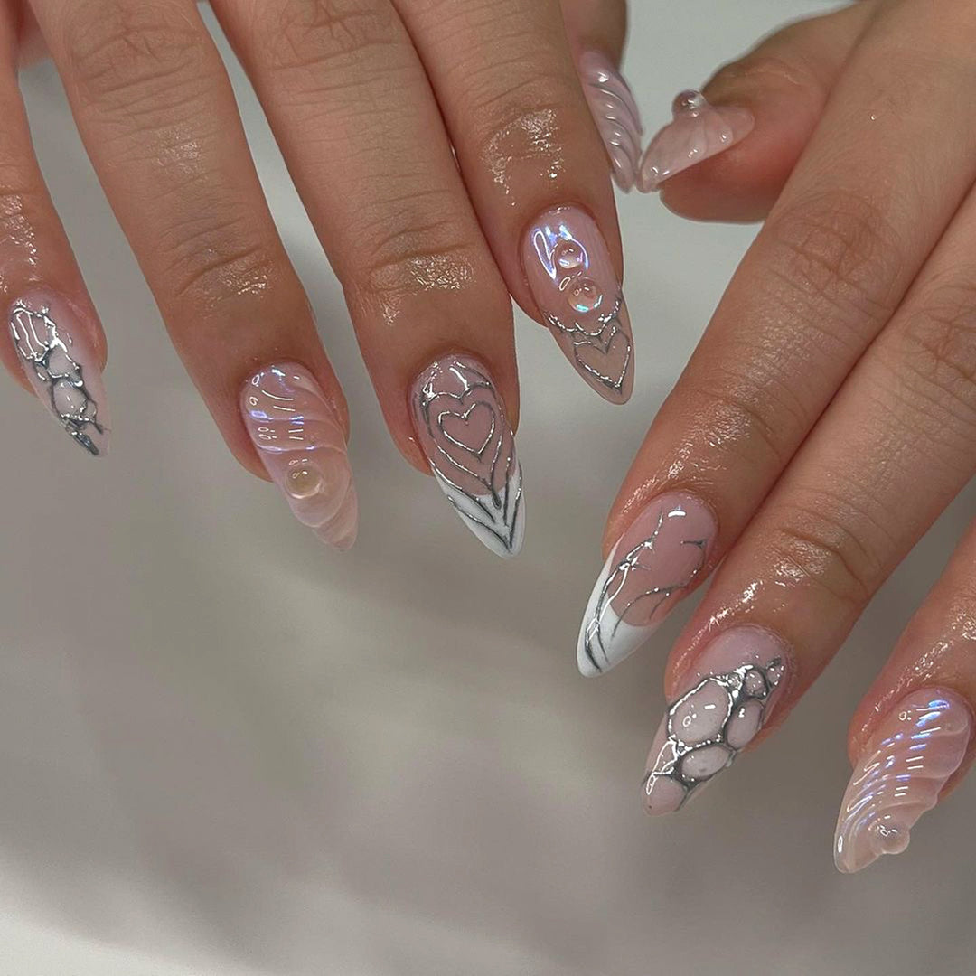 Artistic stiletto nails with holographic effects Bowlift