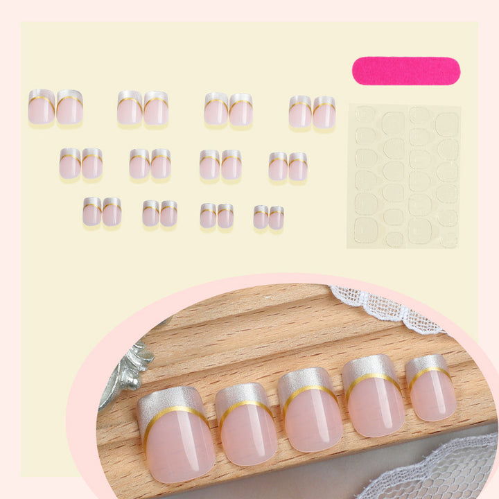 Artificial nail creations with elegant gold trim Bowlift