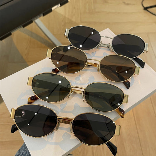 Women elegant oval sunglasses with gold-colored frame Bowlift