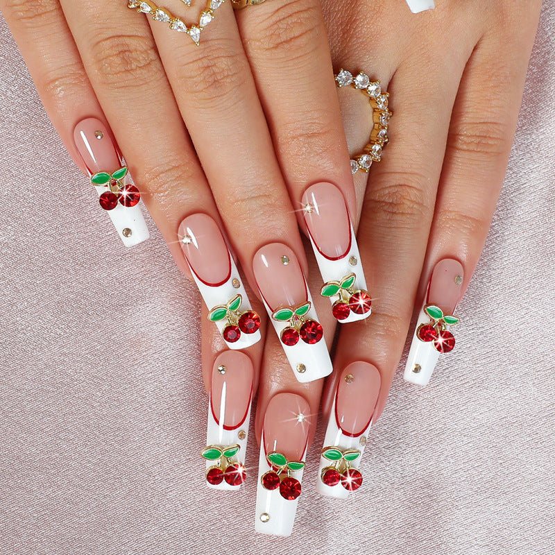 Artificial nail set with cherry motif and sparkling rhinestones Bowlift