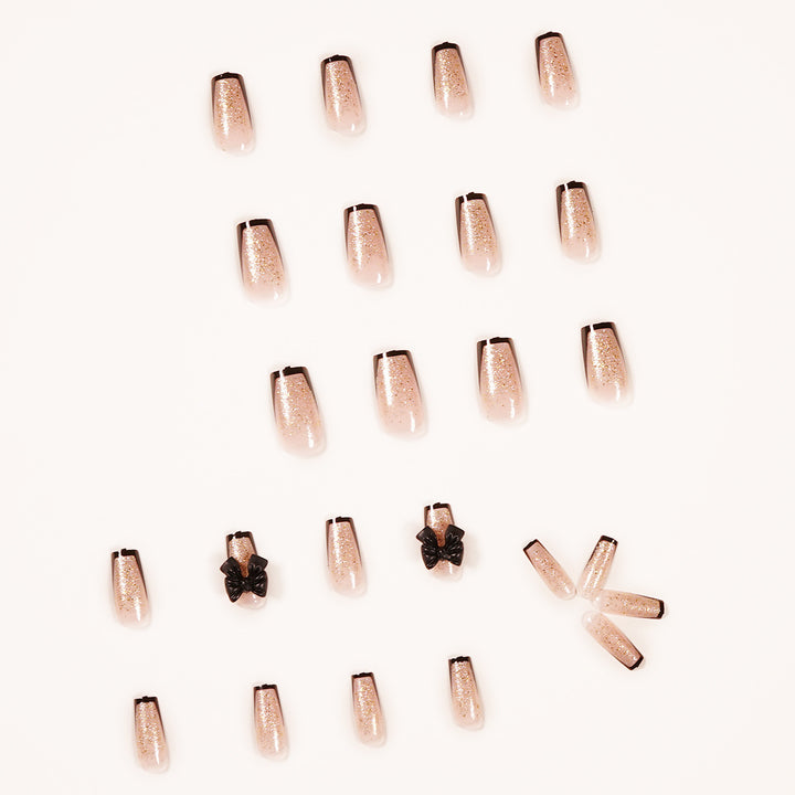 Artistic Nail Extensions with Glitter and Bow Accents Bowlift