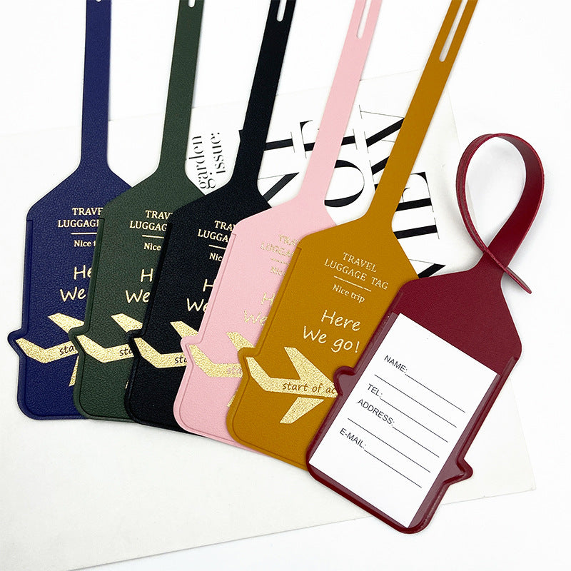 premium leather travel luggage ID tag with embossed airplane motif and adjustable strap Bowlift