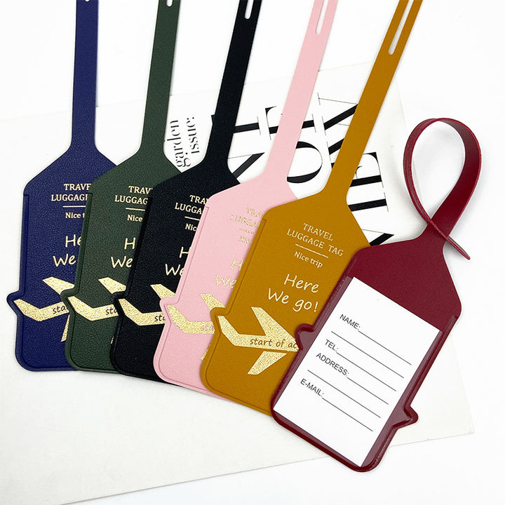premium leather travel luggage ID tag with embossed airplane motif and adjustable strap Bowlift
