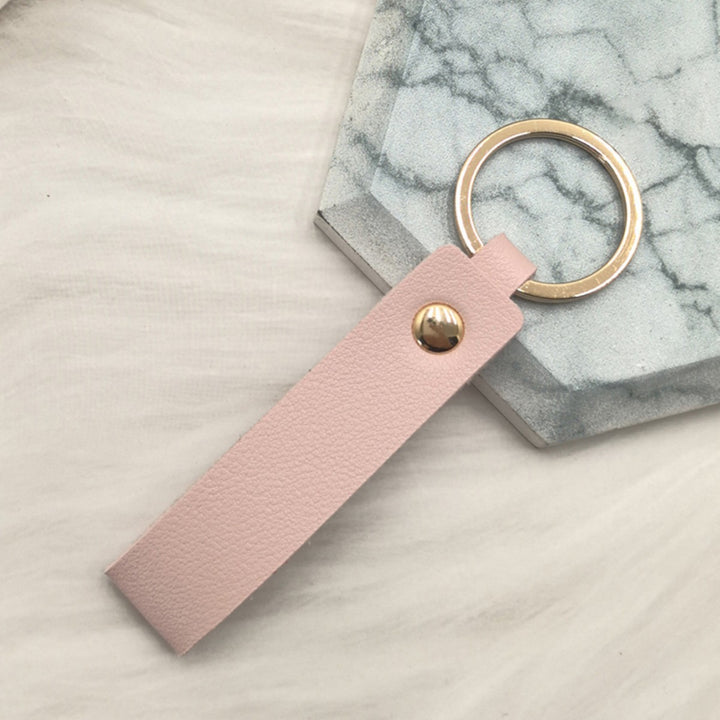 Unisex keychain made of high-quality synthetic leather with elegant metal embellishment Bowlift