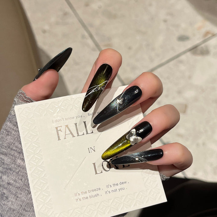 Artistic Stiletto Nail Extensions with Metallic Accents Bowlift