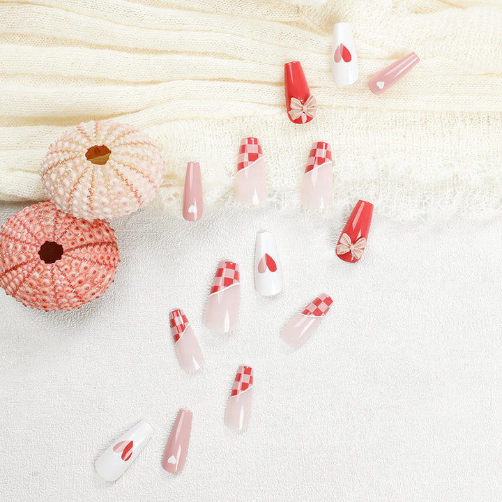 Artful nail extensions with playful designs and romantic accents Bowlift