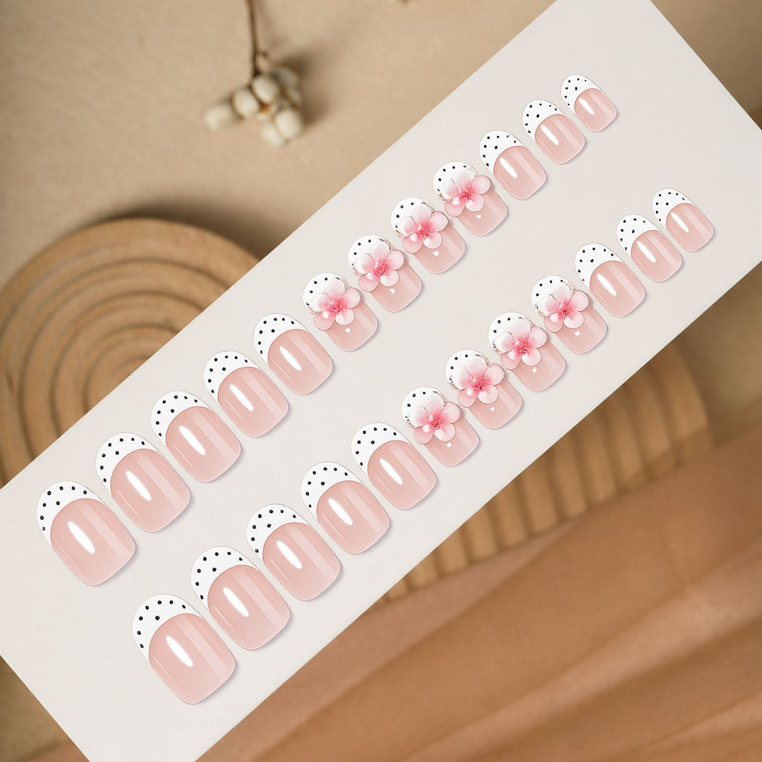 Artificial nail set with delicate floral designs and elegant accents Bowlift