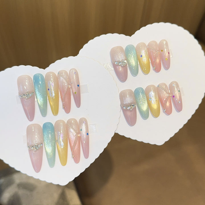 Artificial nails with shimmering effects and sparkling rhinestone details Bowlift