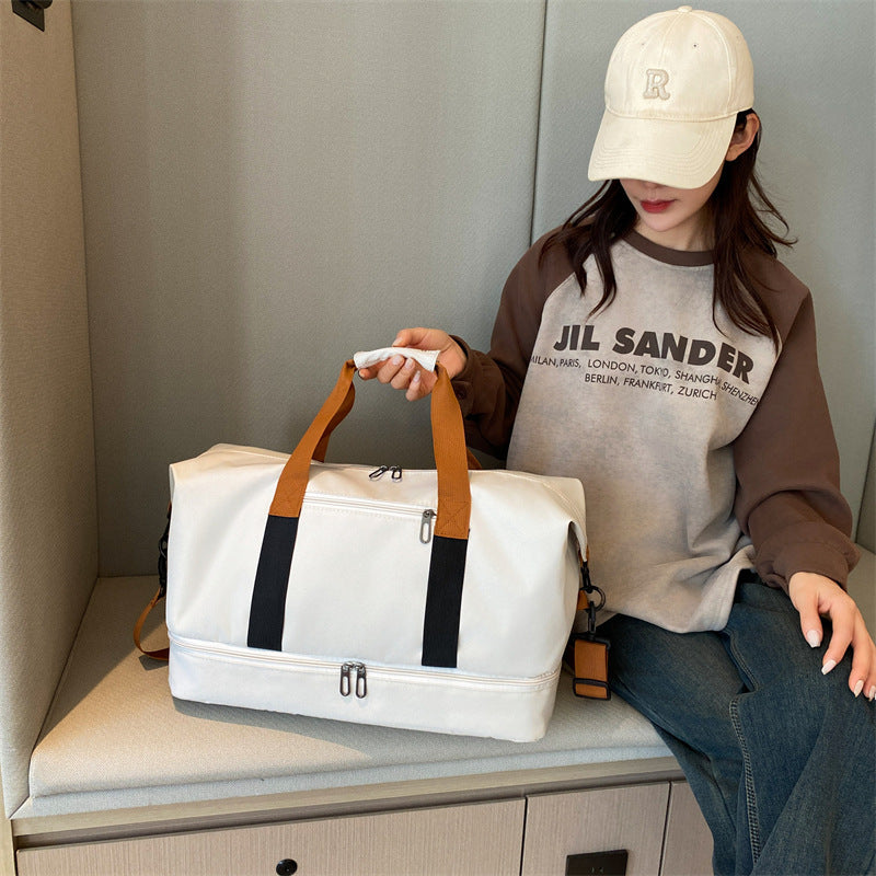 Sporty travel bag with sturdy carrying handles and adjustable shoulder strap Bowlift