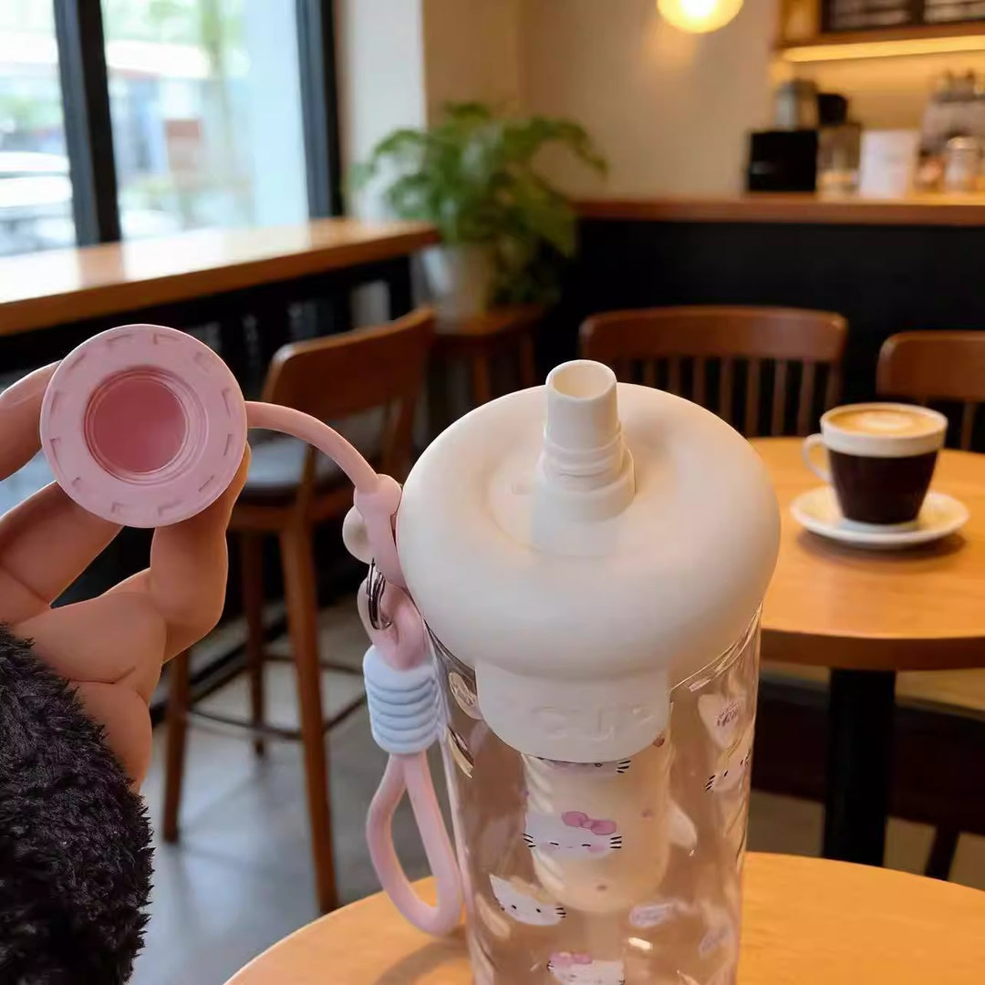 Women's water bottle with cheerful design and practical carrying handle Bowlift