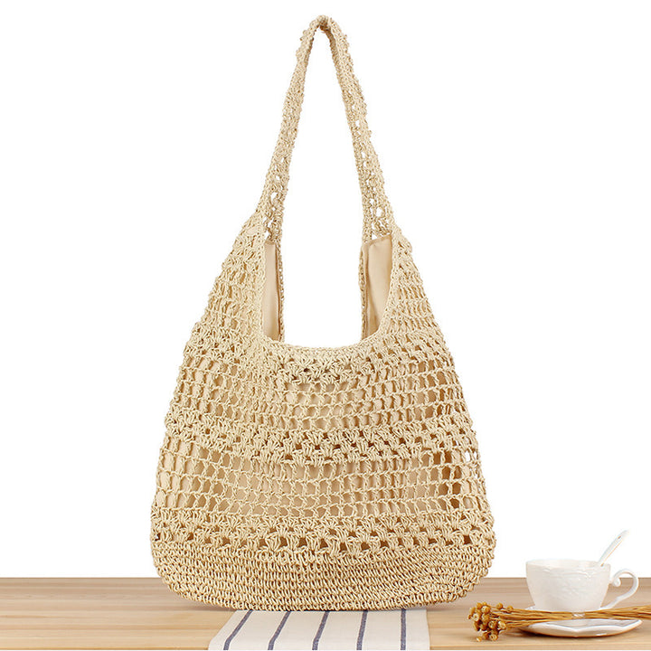 Handbag with floral appliqué Made of natural material Bowlift