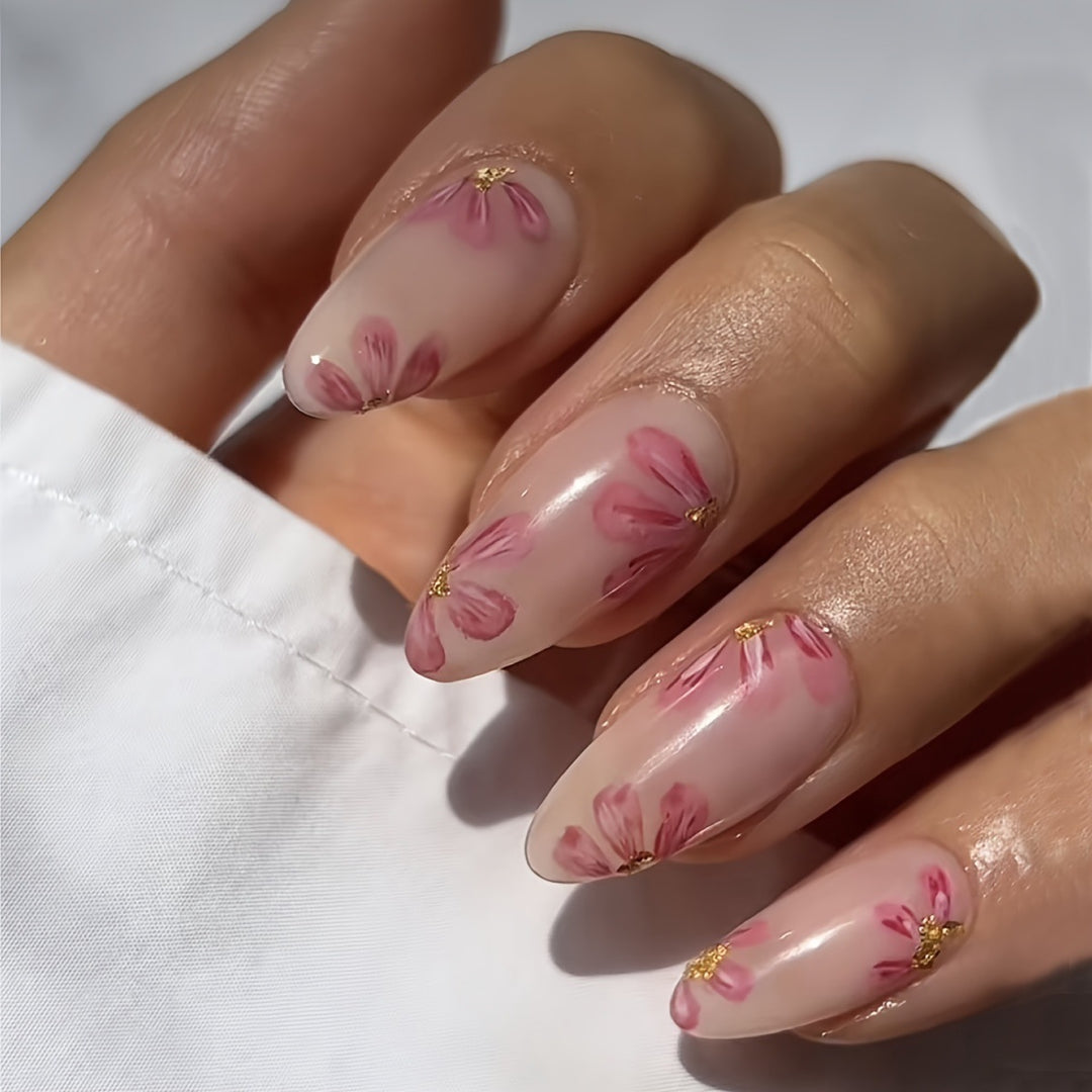 Artificial nail set with floral accents and gold embellishments Bowlift