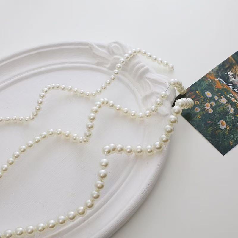 Elegant Pearl Necklace Bowlift