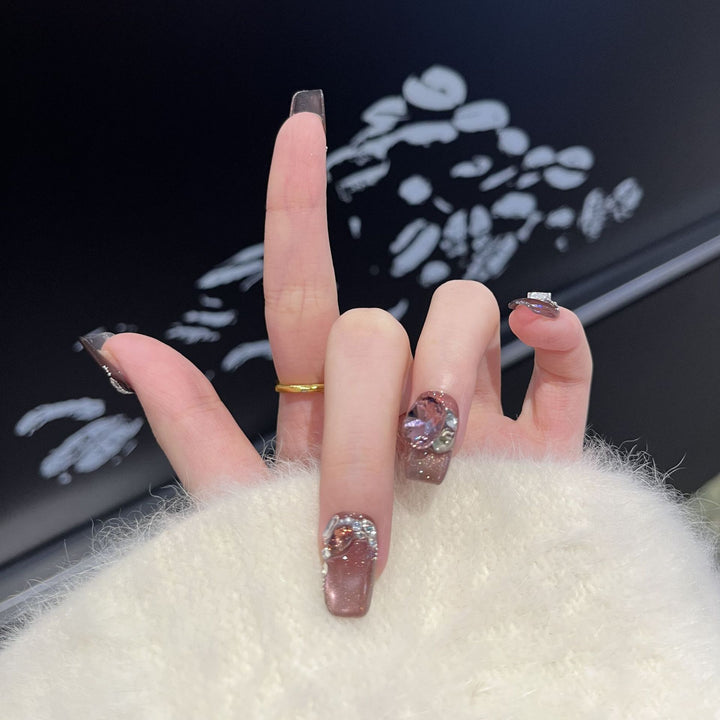Decorative Press-On Nail Design with Gemstone Accents Bowlift