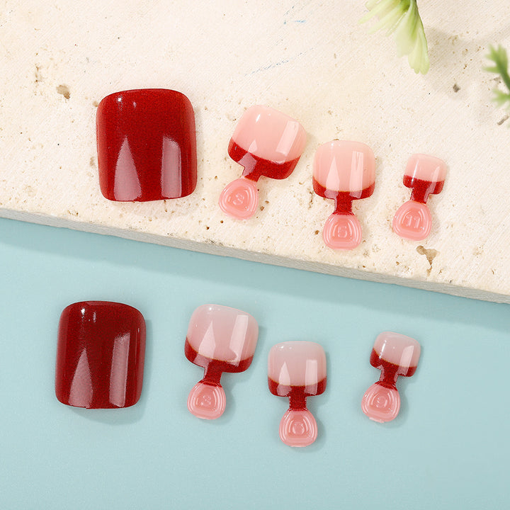 Acrylic nail set in elegant red and nude design Bowlift
