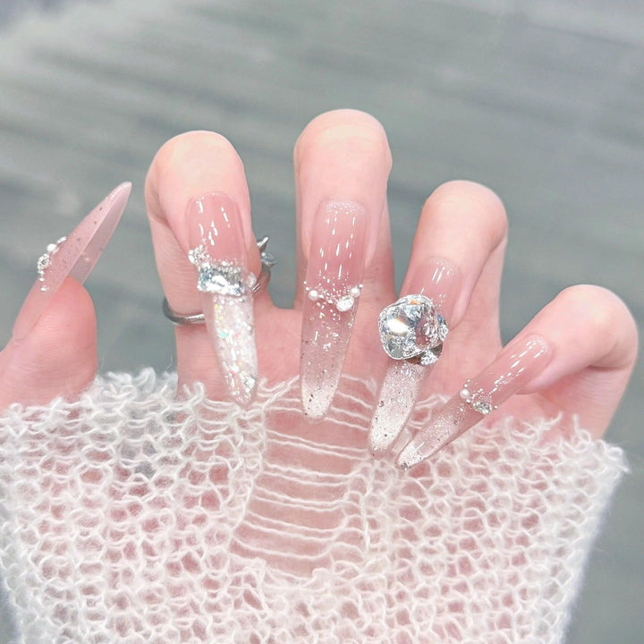 Artificial nails with glitter and crystal embellishments Bowlift