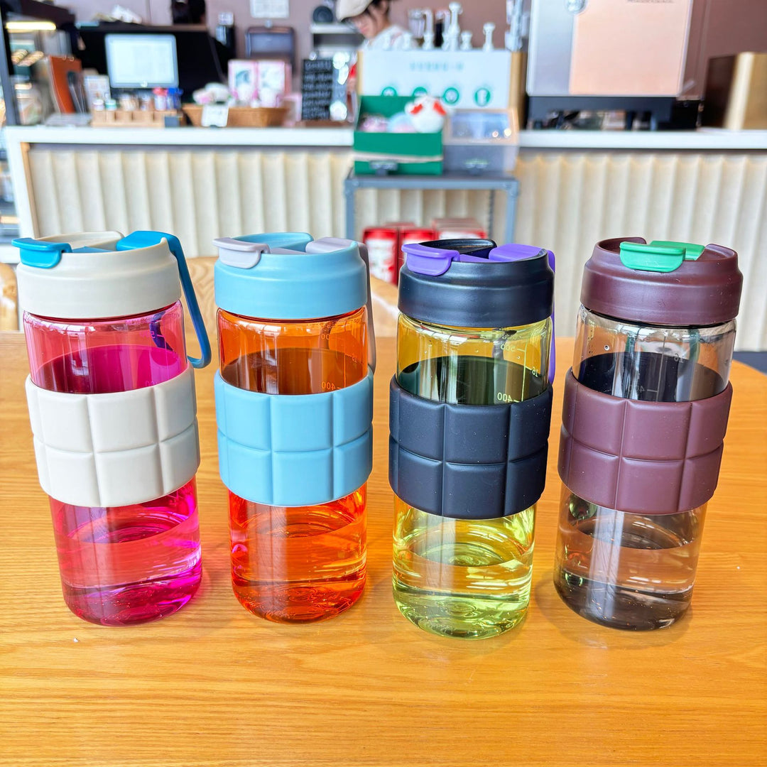 Women's transparent drinking bottle with non-slip silicone coating Bowlift