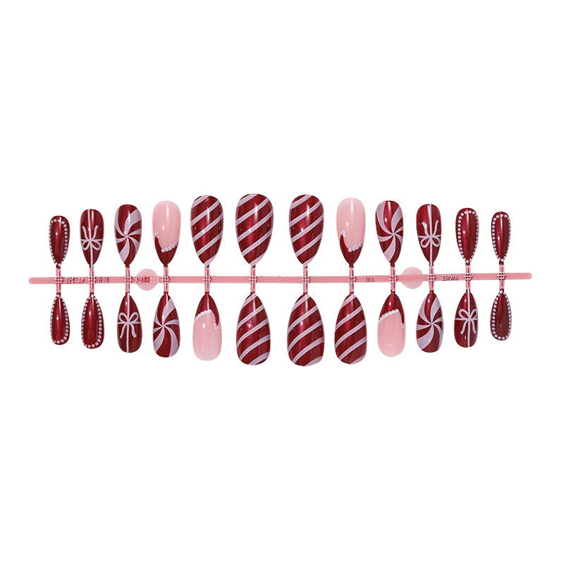 artfully designed nail set with festive candy cane motifs Bowlift
