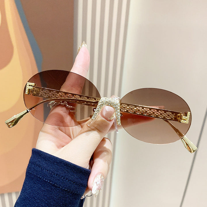 Women's sunglasses with glittering frame and oval lenses Bowlift