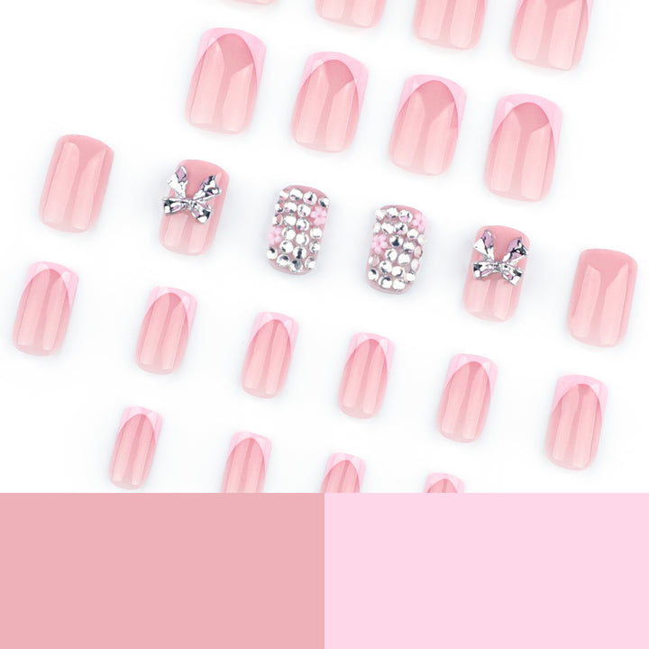 Artful nail art with glitter accents and bow decoration Bowlift
