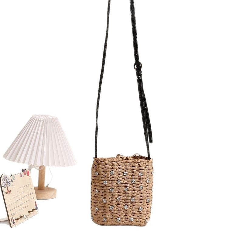 Bag made of woven natural material with sparkling appliqués Bowlift