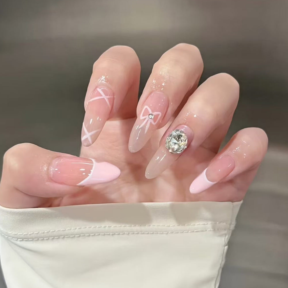 Decorative Press-On Nail Extensions with Bow and Rhinestone Accents Bowlift