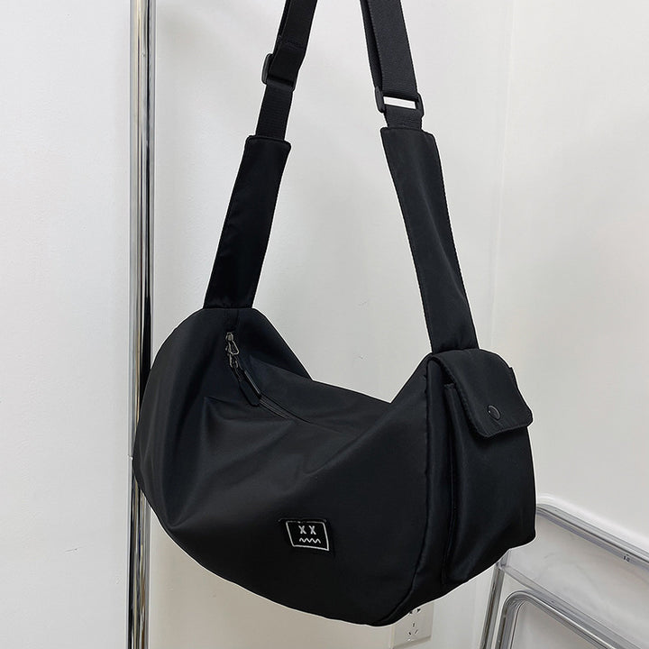 Sporty shoulder bag with adjustable carrying strap Bowlift