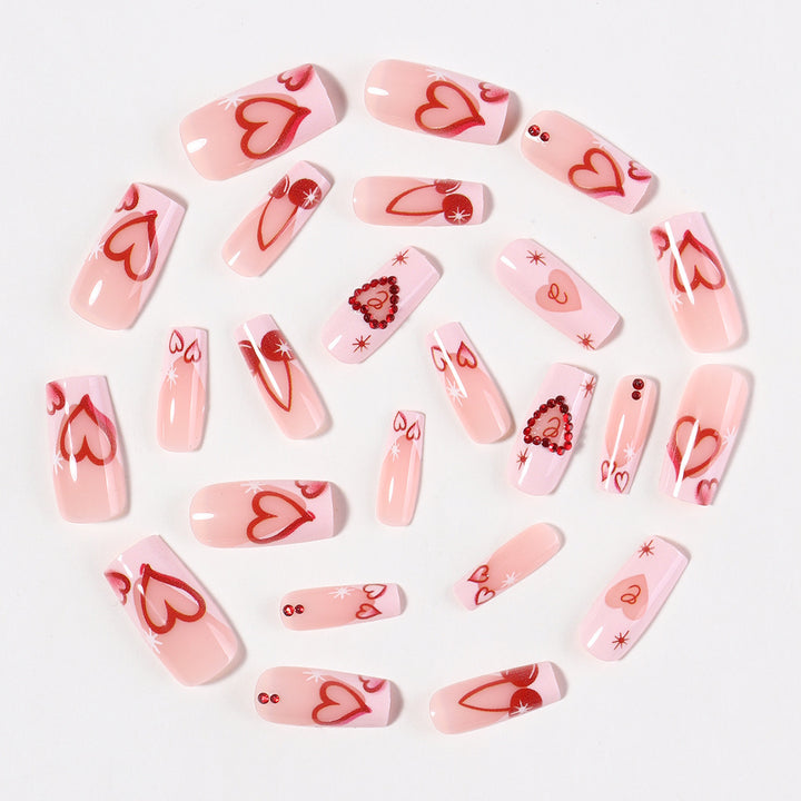 Artificial nail set with romantic heart designs and sparkling rhinestone decorations Bowlift