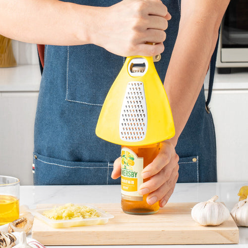 Multifunctional kitchen grater with integrated bottle opener function Bowlift