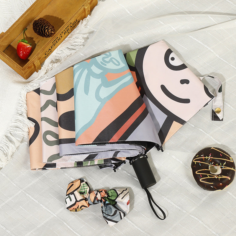 Women's folding umbrella with colorful animal design and durable frame Bowlift