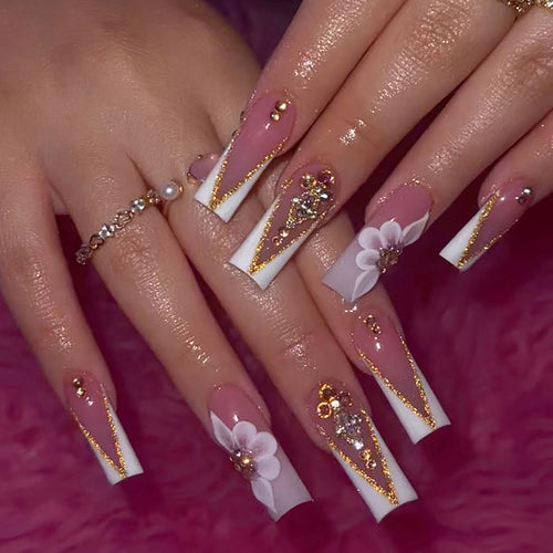Artistic nail extensions with floral and glitter accents Bowlift