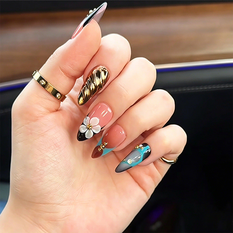 Artificial nail set with filigree floral decorations and glamorous accents Bowlift