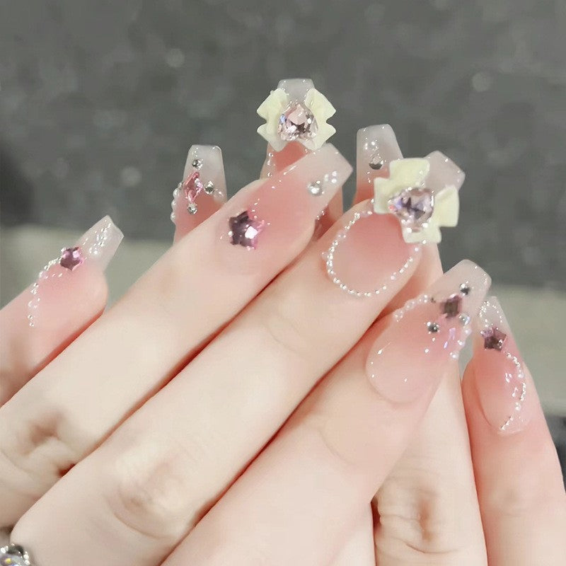 Artificial nails in creative moon and star design Bowlift