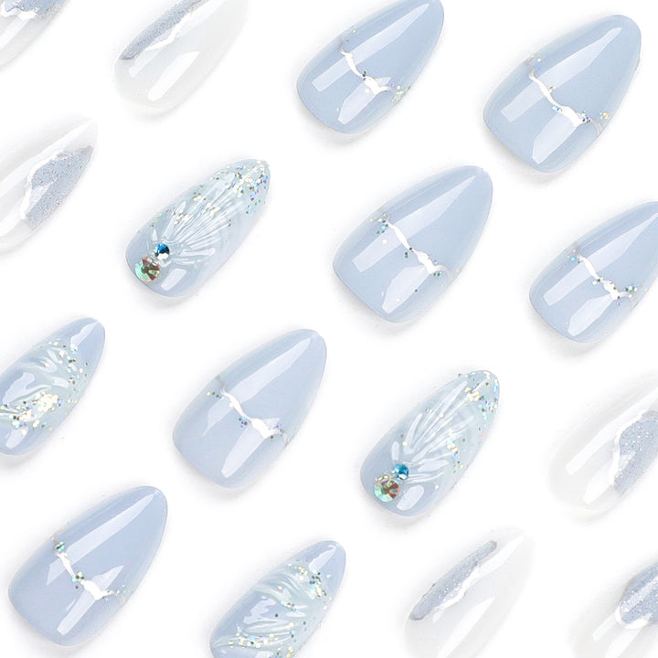 Artful stiletto nails with elegant glitter and floral design Bowlift
