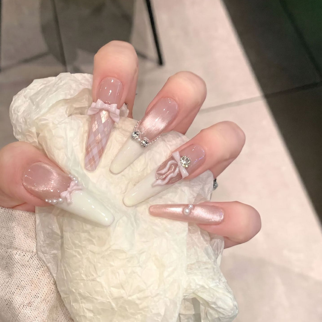 Elegant Stiletto Press-On Nail Set with Decorative Bow and Gem Accents Bowlift