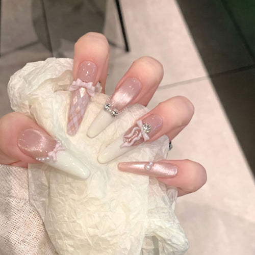 Elegant Stiletto Press-On Nail Set with Decorative Bow and Gem Accents Bowlift
