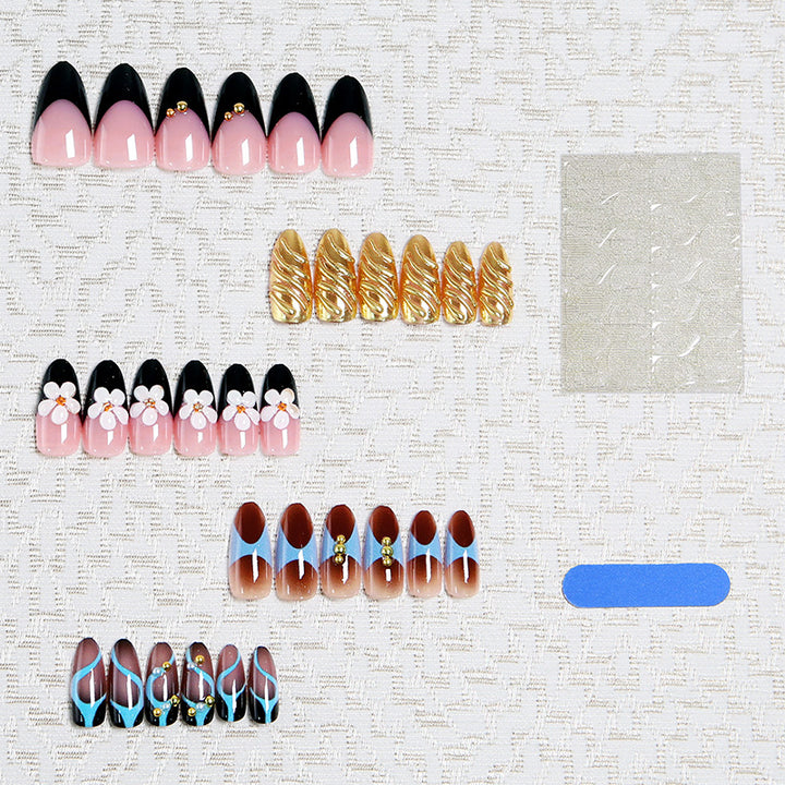 Artificial nail set with filigree floral decorations and glamorous accents Bowlift