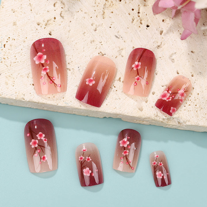 Artificial nails set with floral accents Bowlift