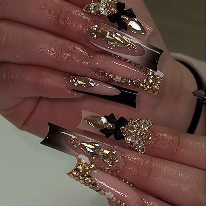 Artificial nail set with elegant 3D decorations and crystal accents Bowlift
