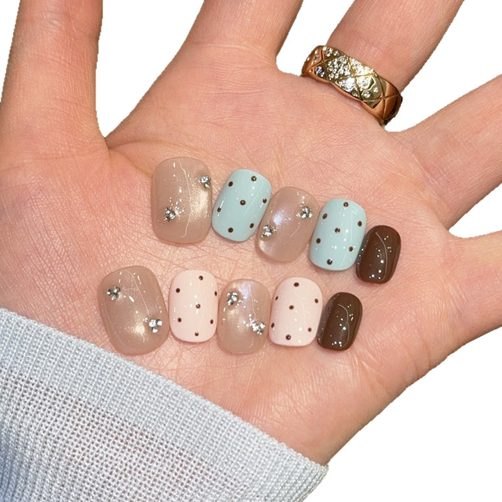 Acrylic nails with rhinestones and glitter Bowlift